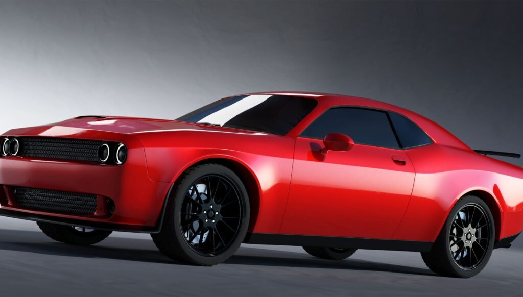 Red muscle car with black wheels in a studio setting.