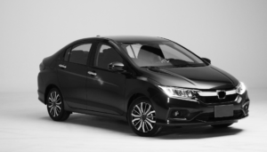 Black sedan car displayed in a white studio background.